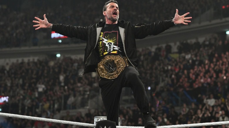 CM Punk poses on the ropes, World Heavyweight Championship around his waist, before cutting a promo on 