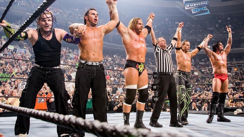 Jeff Hardy, Matt Hardy, Triple H, Shawn Michaels, and CM Punk celebrate together after their victory at Survivor Series 2006.