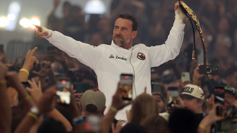 CM Punk embraces the fans in the crowd ahead of his WrestleMania 42 title defense