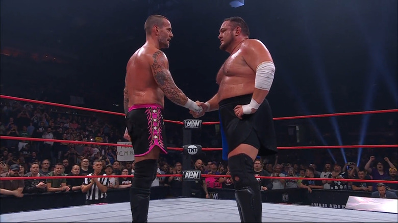 CM Punk and Samoa Joe shake hands