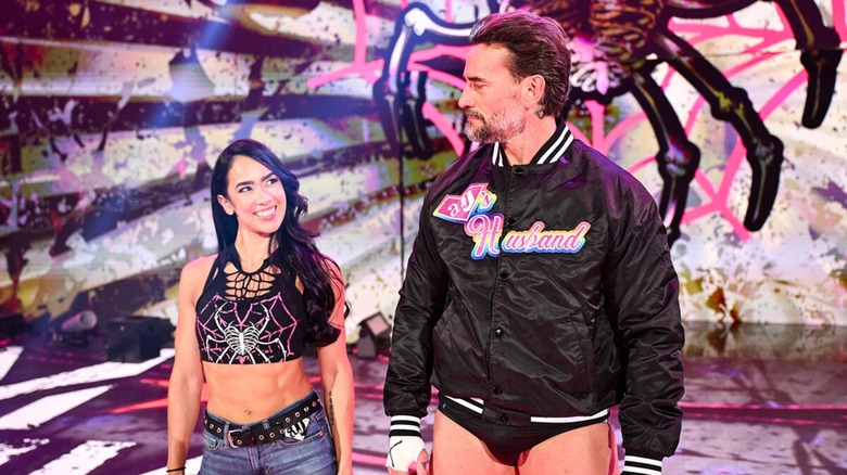 AJ Lee and CM Punk sharing looks ahead of their match at Wrestlepalooza, 2025.