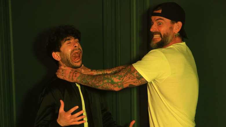 CM Punk and Tony Khan, backstage at All In