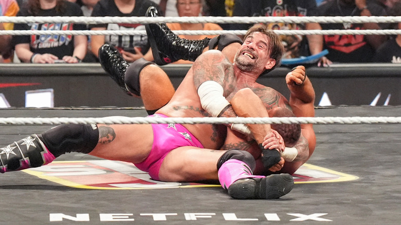 CM Punk locking Bron Breakker into an Anaconda Vice during the Gauntlet match on 