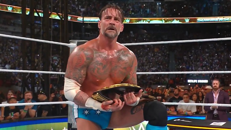 CM Punk wins WWE World Heavyweight Championship