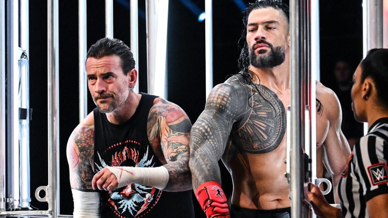 CM Punk squeezing past Roman Reigns at Survivor Series: WarGames to enter into the match before him.