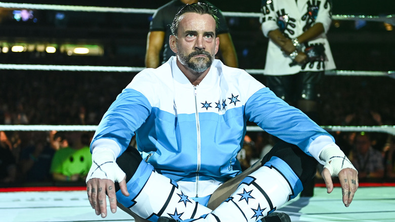 CM Punk sitting in the ring at WWE SummerSlam 2025
