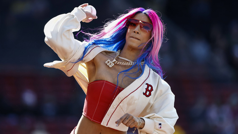 Mercedes Mone tosses a baseball