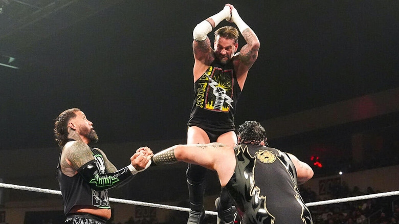 CM Punk and Jey Uso double team Bronson Reed