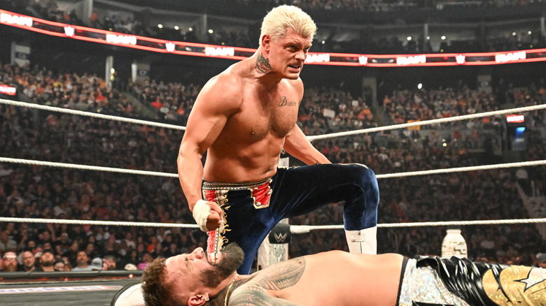 Cody Rhodes wrestling Jey Uso on WWE Raw with an aggressive look on his face
