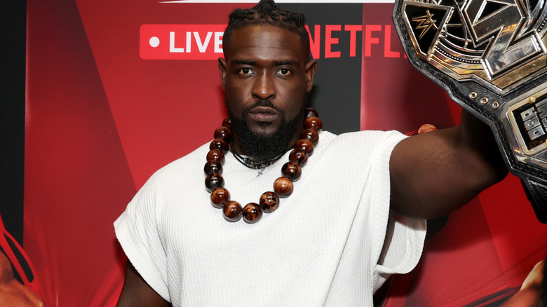 Oba Femi holding the NXT Championship