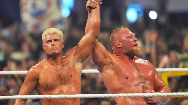 Cody Rhodes & Brock Lesnar raising hands
