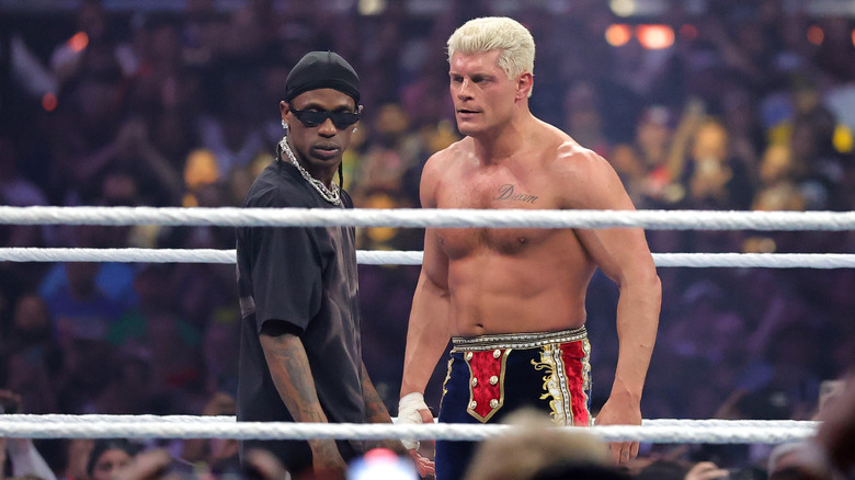 Travis Scott and Cody Rhodes at Elimination Chamber