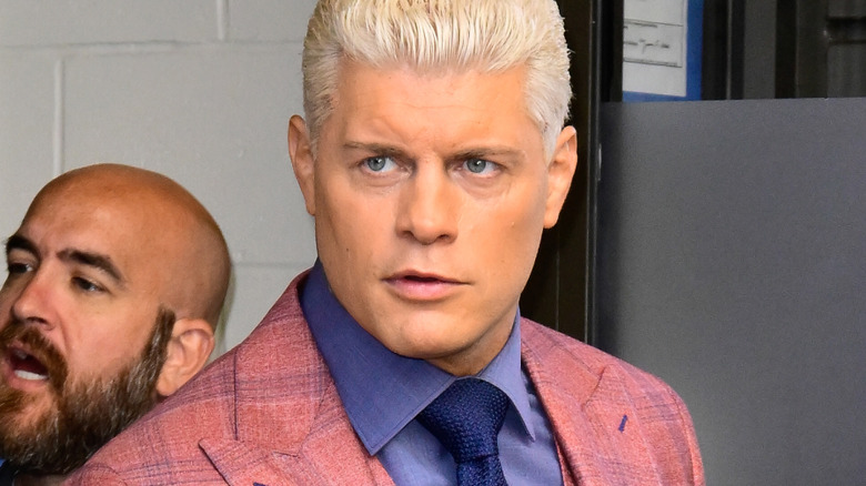 Cody rhodes holding a coffee