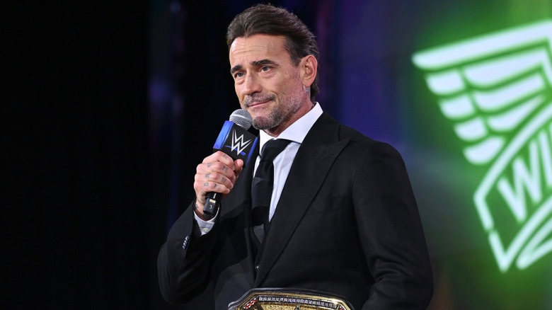 CM Punk holding a microphone