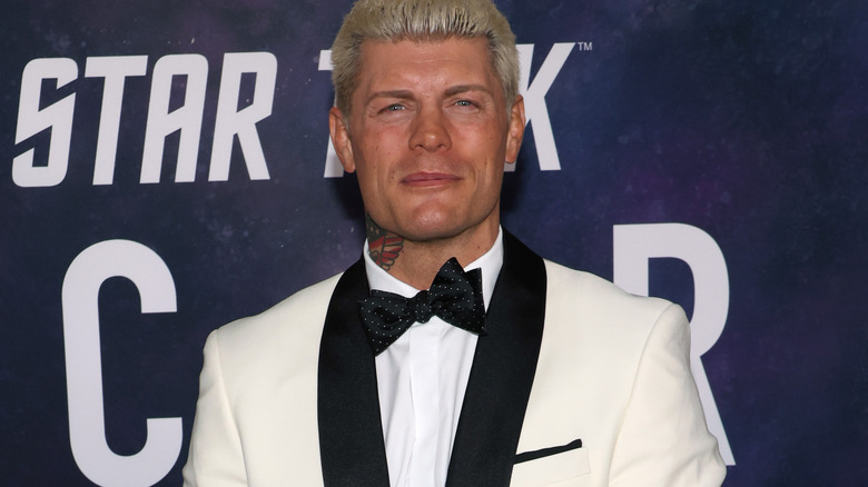 Cody Rhodes wearing a white suit