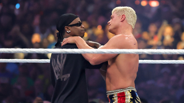 Travis Scott and Cody Rhodes in the ring