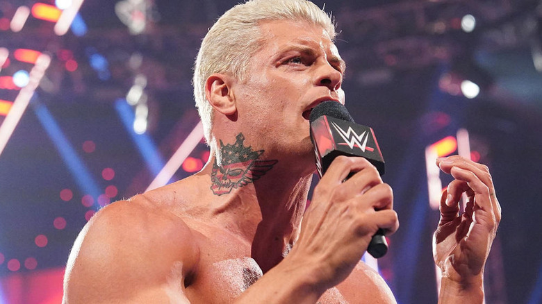 Cody Rhodes talking into a microphone on "WWE Raw"