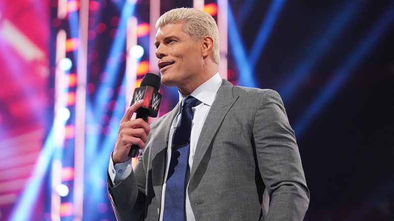 Cody Rhodes smirks as he addresses the fans