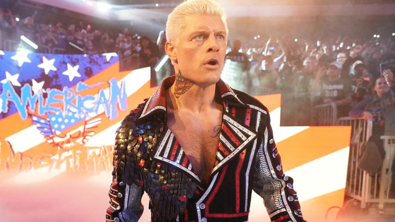 Cody Rhodes wearing black, red, and white ring jacket