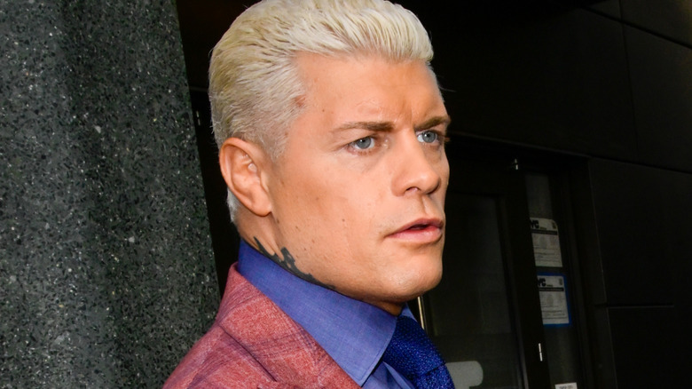 Cody rhodes holding a coffee
