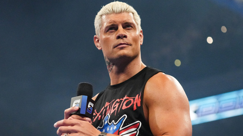 Cody Rhodes holding a microphone