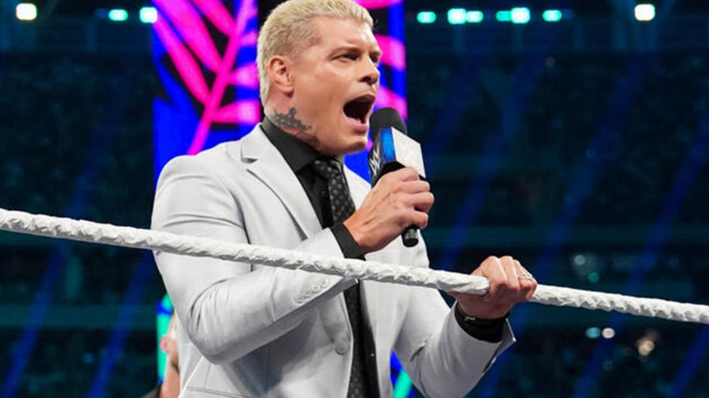 Cody Rhodes yelling into microphone