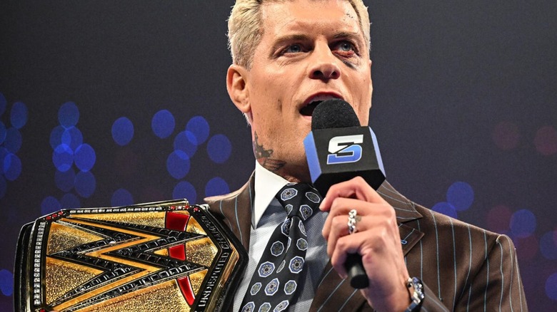 Undisputed WWE Champion Cody Rhodes cuts a promo with the belt on his shoulder, sporting a black eye, on an episode of 