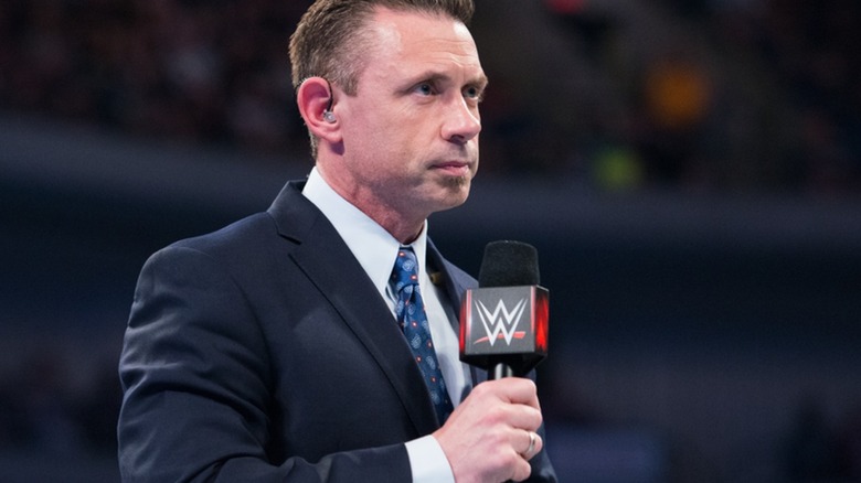 Michael Cole with a microphone