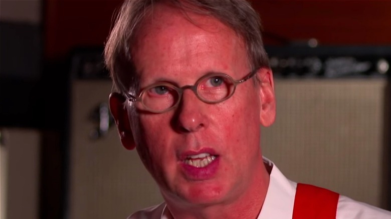 Jim Johnston talking during an interview with WWE.