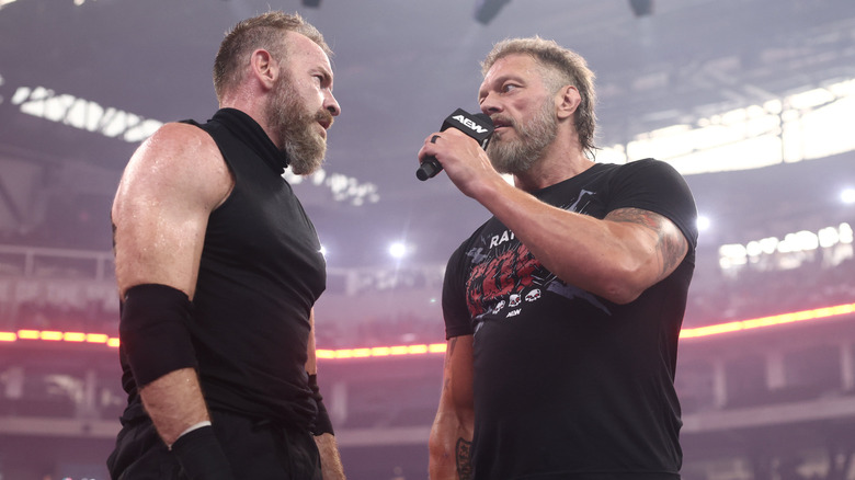Adam Copeland cuts a promo on Christian Cage in the middle of the ring after a match at AEW All In Texas.