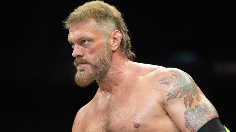 Cope stares down his opponents in the ring during a match on an episode of 