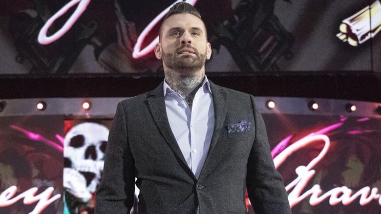 Corey Graves makes his entrance as he heads down the ramp to the commentary desk on an episode of WWE programming.