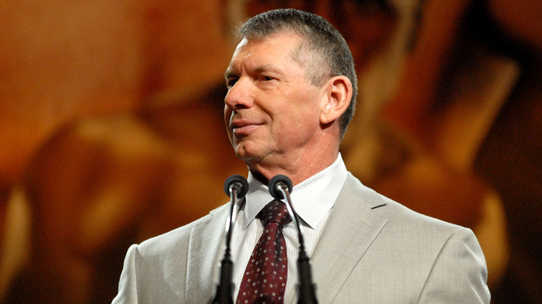 Former WWE CEO and Chairman Vince McMahon looks out towards the crowd before giving a speech