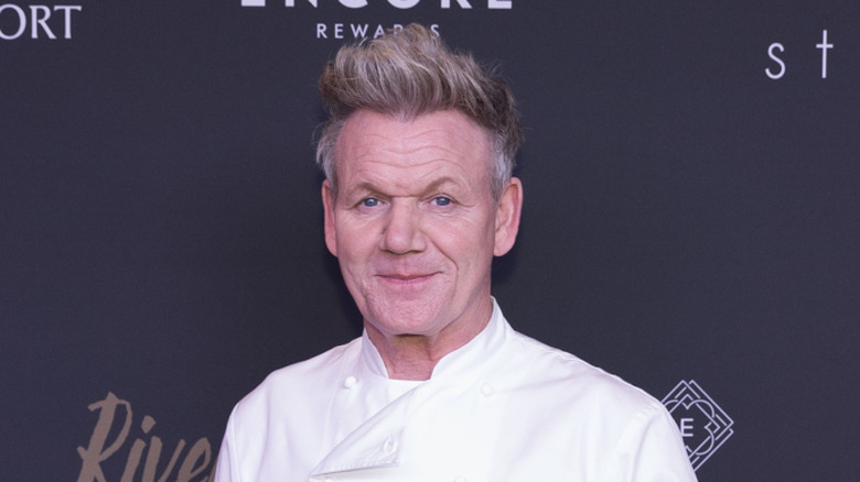 British Chef Gordon Ramsay poses at a red carpet event for one of his restaurant openings