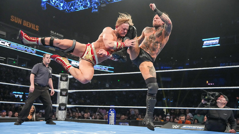 Ilja Dragunov eats a knee from Aleister Black on 