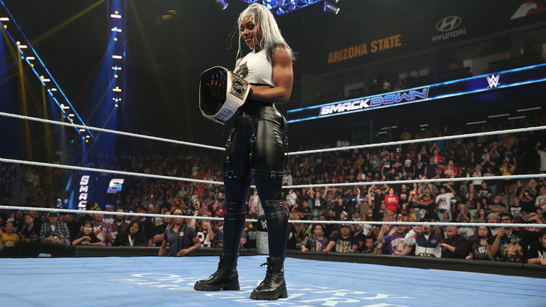 Jade Cargill stares at the WWE Women's Championship