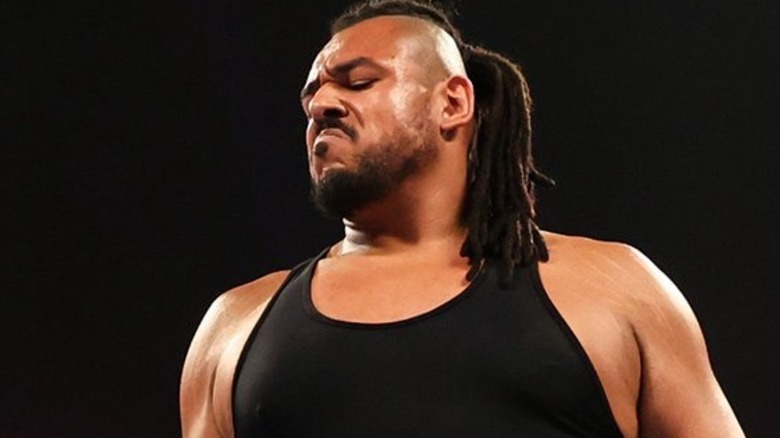 Dabbo-Kato looking down at a fallen Apollo Crews