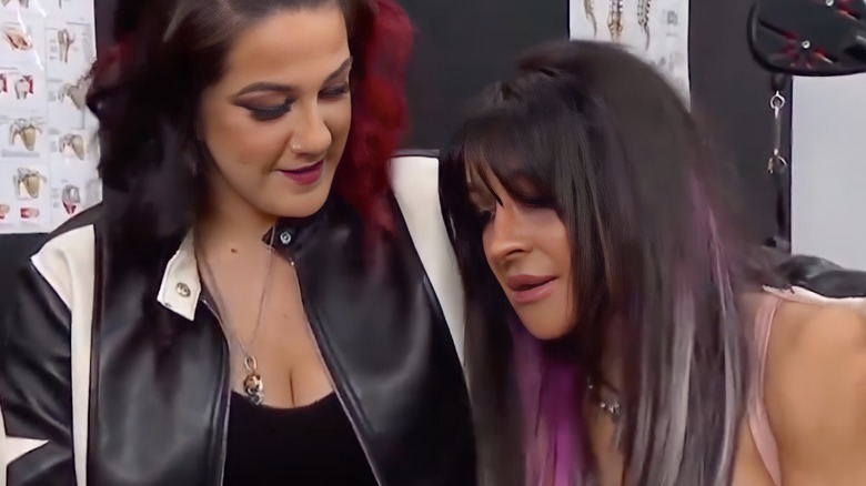 Bayley comforts Dakota Kai