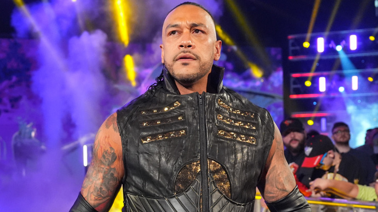 Damian Priest wearing a black ring jacket