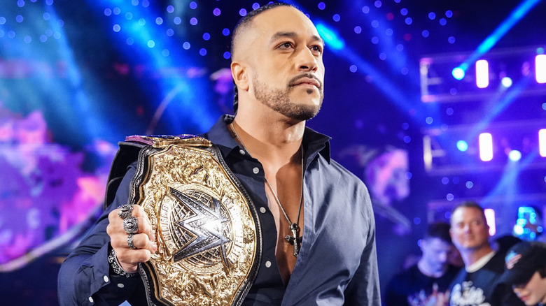 Damian Priest holding the WWE World Heavyweight Championship