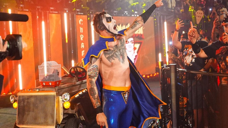 Danhausen poses for the crowd, Danhausen mobile and plushie cat in a cage behind him, before his match against JD McDonagh at WWE Saturday Night's Main Event on July 18, 2026.
