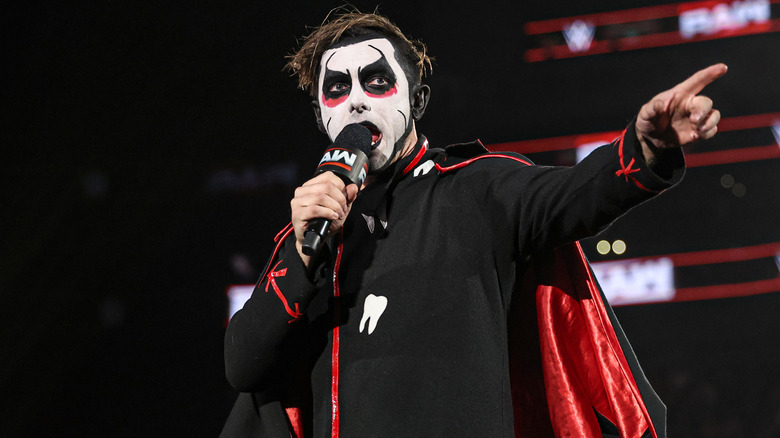 Danhausen holding a WWE Raw microphone