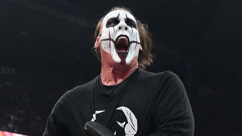 Sting during a match in AEW, locking in the Scorpion Death Lock.