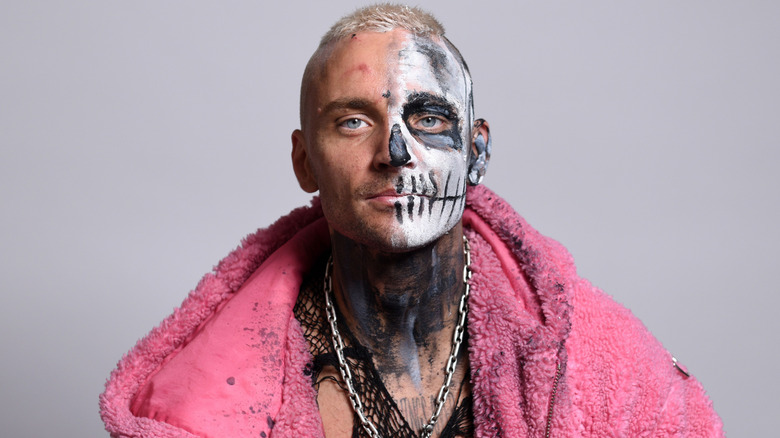 Darby Allin wearing a pink jacket