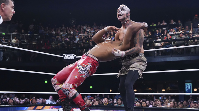 Darby Allin sets up a move on Kevin Knight in the ring during their match on July 22, 2026 edition of 