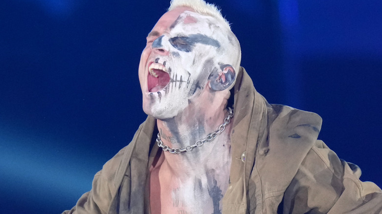 Darby Allin yelling with his eyes clothes in his entrance attire