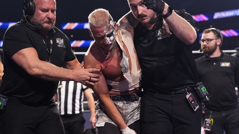 Darby Allin being helped away