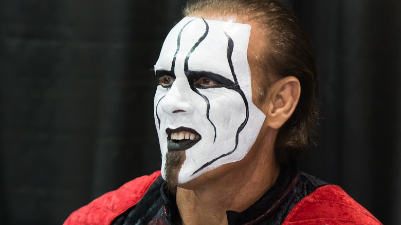 Sting in makeup, smiling