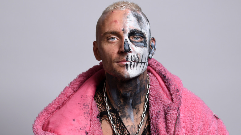 Darby Allin wearing a pink jacket