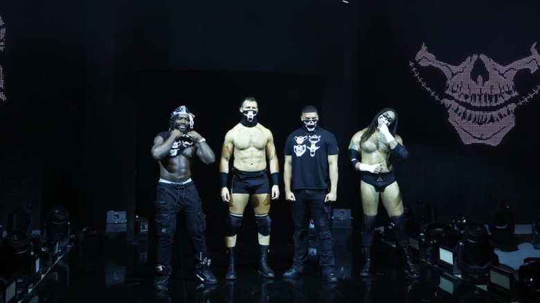 DarkState's Saquon Shugars, Cutler James, Dion Lennox, and Osiris Griffin pose on the stage ahead of a match on 